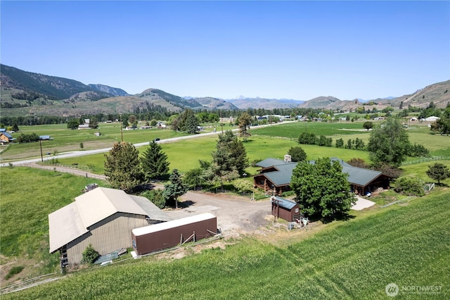 birds eye view of property featuring a rural view and a mountain view