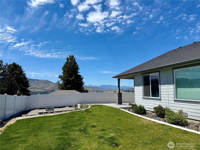 2764 N Breckenridge Dr, East Wenatchee, WA 98802 - view of yard with a mountain view, an outdoor fire pit, and a patio area