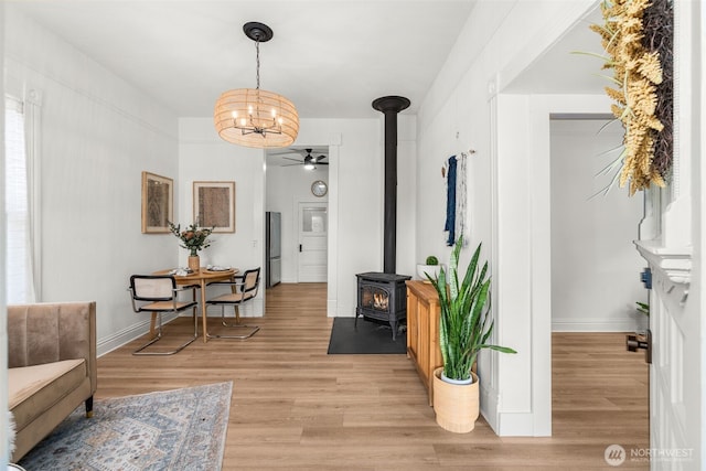 interior space with baseboards and light wood-style floors