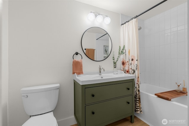 full bath with toilet, vanity, and shower / tub combo with curtain