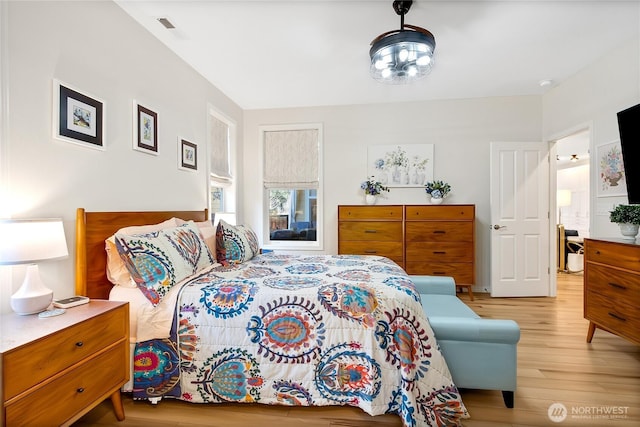 bedroom with light hardwood / wood-style floors