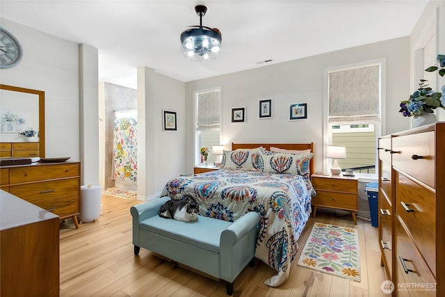 bedroom with light hardwood / wood-style floors