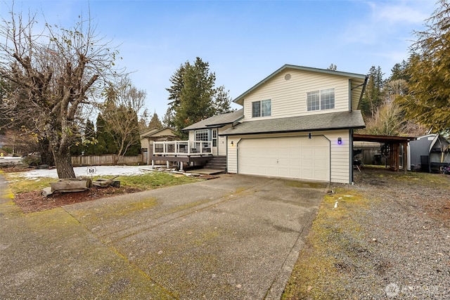 view of front of house featuring a garage and a carport