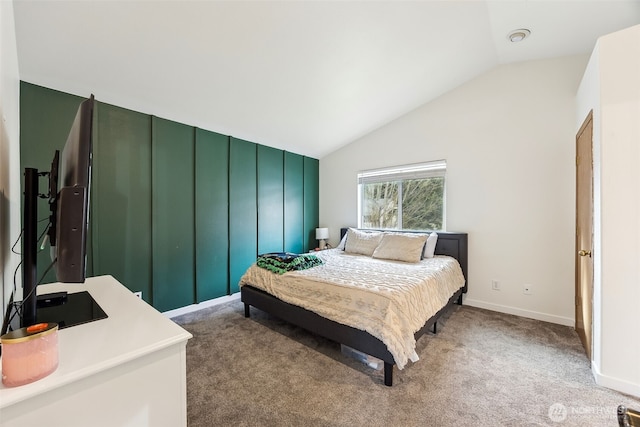 carpeted bedroom with vaulted ceiling