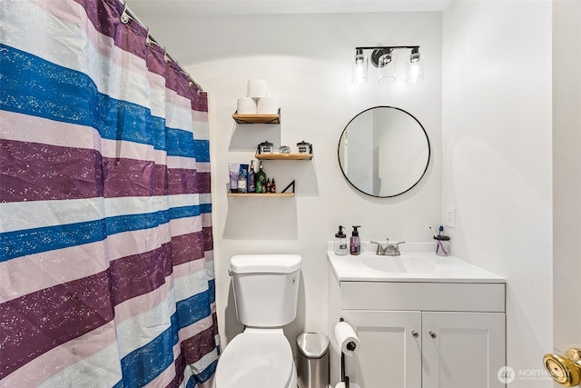 bathroom with vanity and toilet