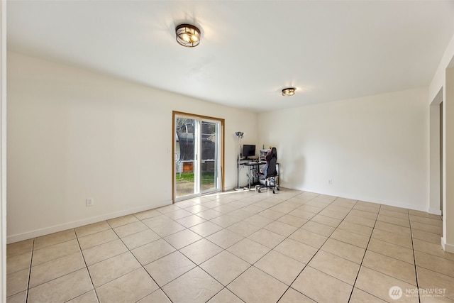 spare room featuring light tile patterned floors