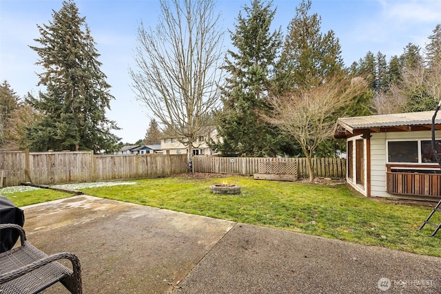 view of yard with a patio and a fire pit