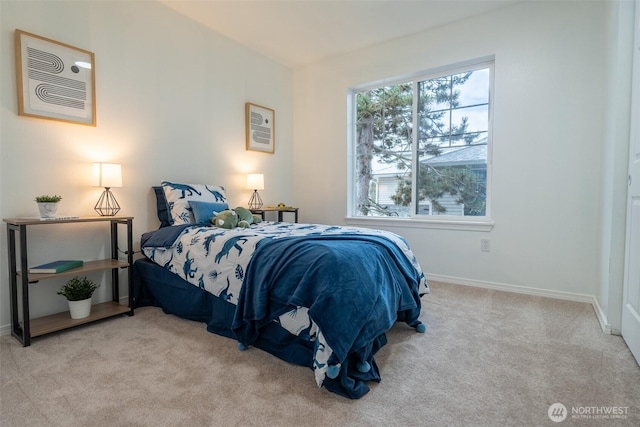 bedroom featuring light colored carpet