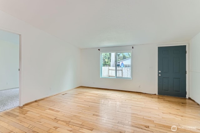 unfurnished room featuring light wood-style floors