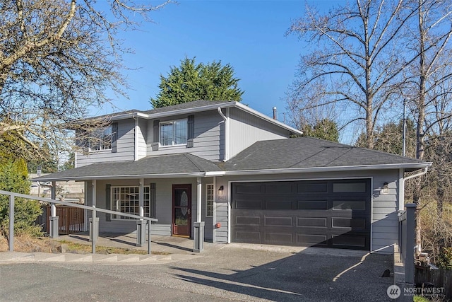 view of front of house with a garage and covered porch