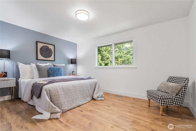 bedroom with light hardwood / wood-style floors