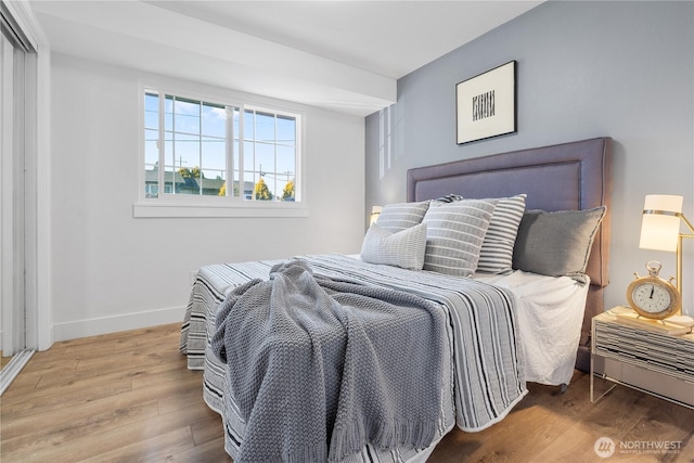 bedroom with wood-type flooring