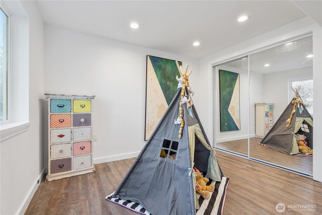 playroom with hardwood / wood-style flooring