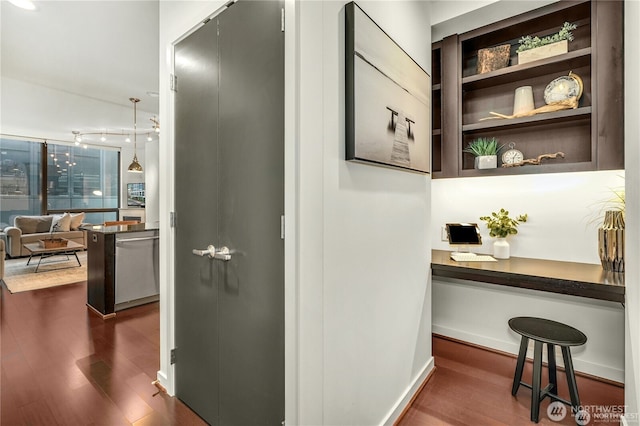 hall with dark hardwood / wood-style floors