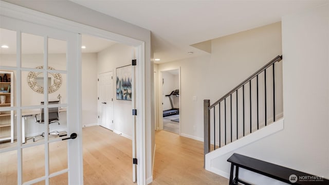 hall featuring recessed lighting, stairway, light wood-style flooring, and baseboards