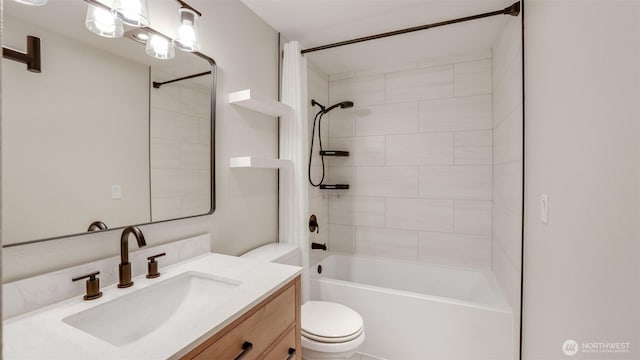 bathroom featuring vanity, toilet, and washtub / shower combination