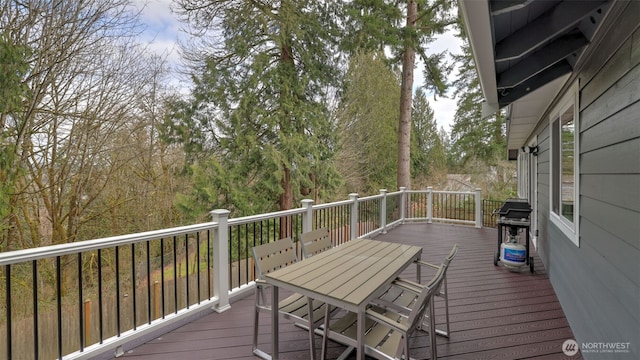 deck featuring outdoor dining area