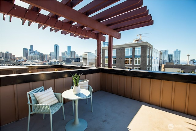 balcony featuring a view of city and a pergola