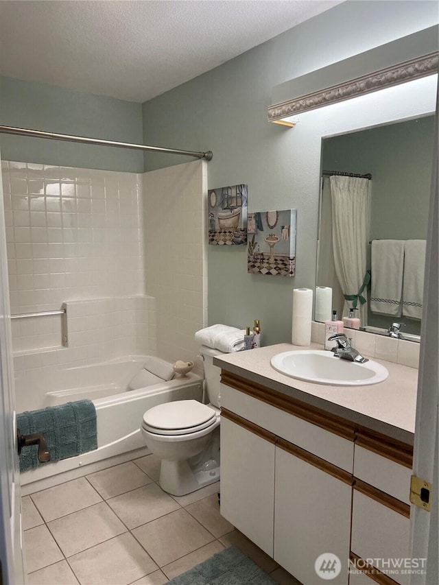 bathroom with toilet, tile patterned floors, shower / bath combination with curtain, vanity, and a textured ceiling