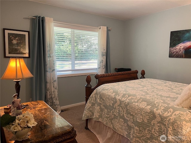 bedroom featuring carpet floors and baseboards