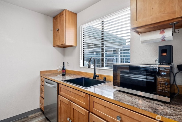 kitchen featuring dark hardwood / wood-style flooring, sink, and stainless steel appliances