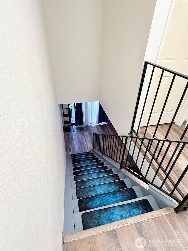 staircase featuring hardwood / wood-style floors