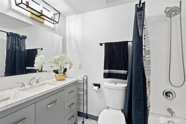 full bathroom with vanity, shower / bath combo, and toilet