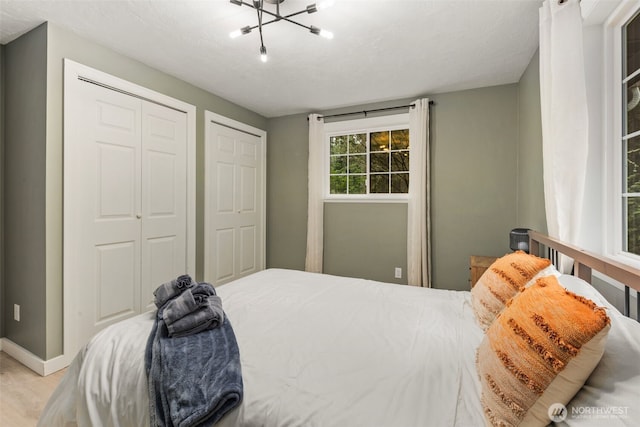 bedroom featuring two closets