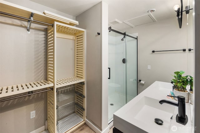 bathroom with vanity and an enclosed shower