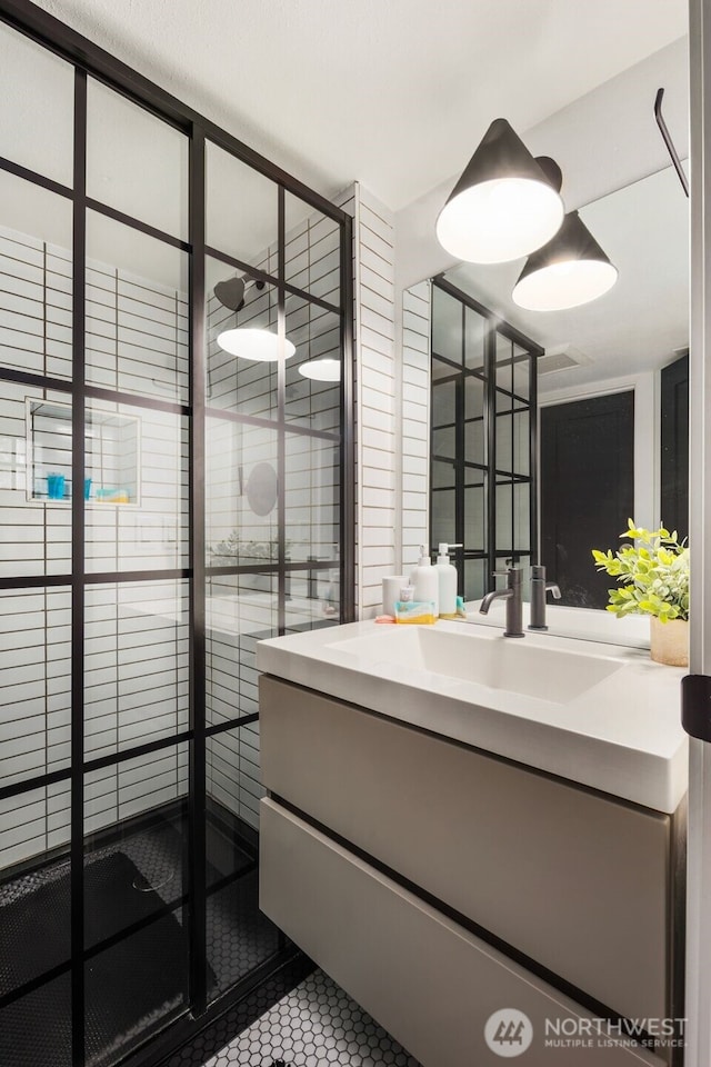 bathroom featuring tile patterned floors and vanity