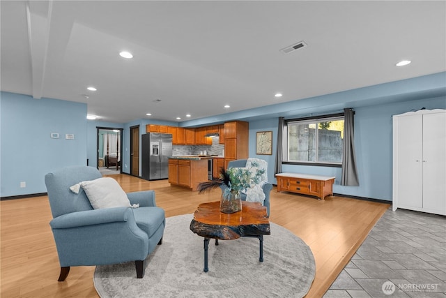 living room with light hardwood / wood-style floors