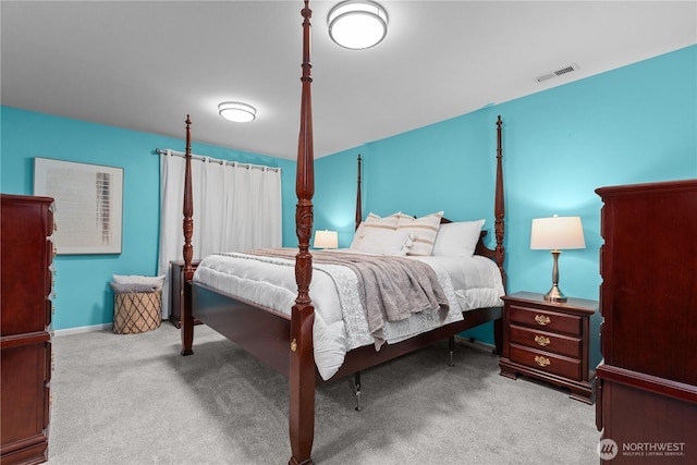 bedroom featuring light colored carpet