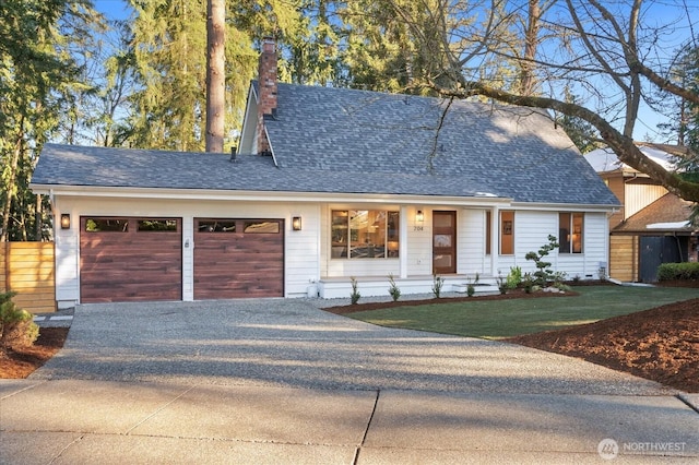 view of front of house with a garage and a front yard