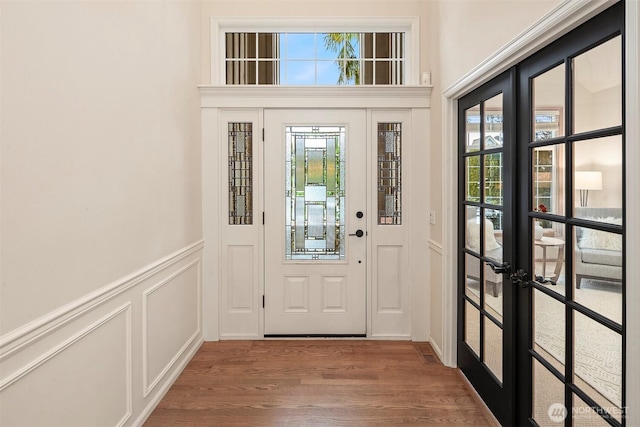 doorway to outside featuring french doors, plenty of natural light, and hardwood / wood-style floors