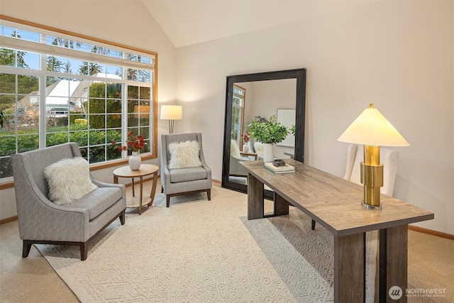 carpeted office featuring vaulted ceiling