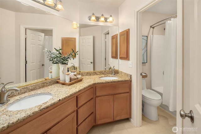 full bathroom with shower / tub combo with curtain, vanity, and toilet