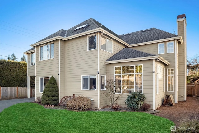 view of home's exterior with a lawn