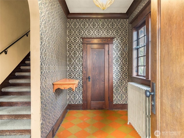 entrance foyer with radiator and crown molding