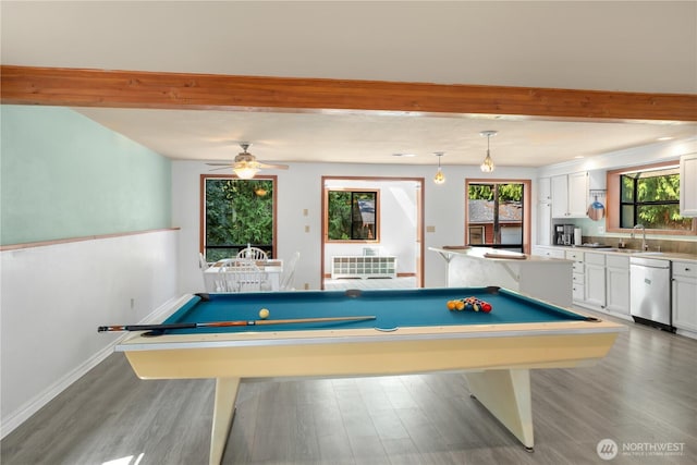 playroom featuring beamed ceiling, sink, hardwood / wood-style floors, and pool table