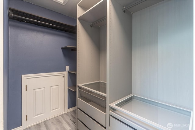 walk in closet featuring light hardwood / wood-style floors