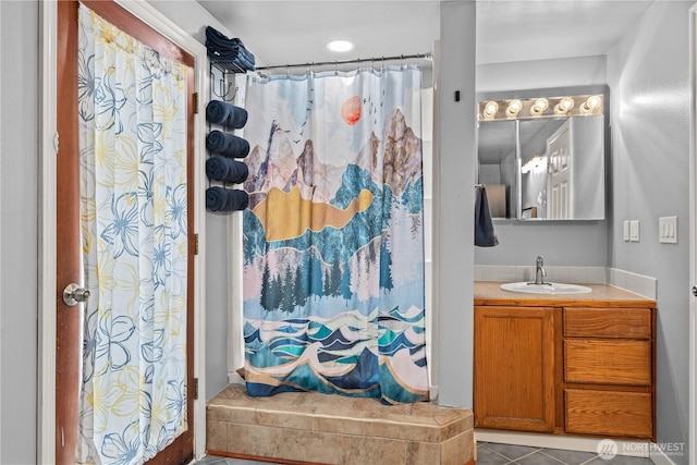 bathroom with vanity, curtained shower, and tile patterned floors