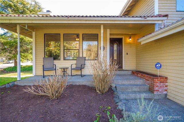 doorway to property featuring a porch