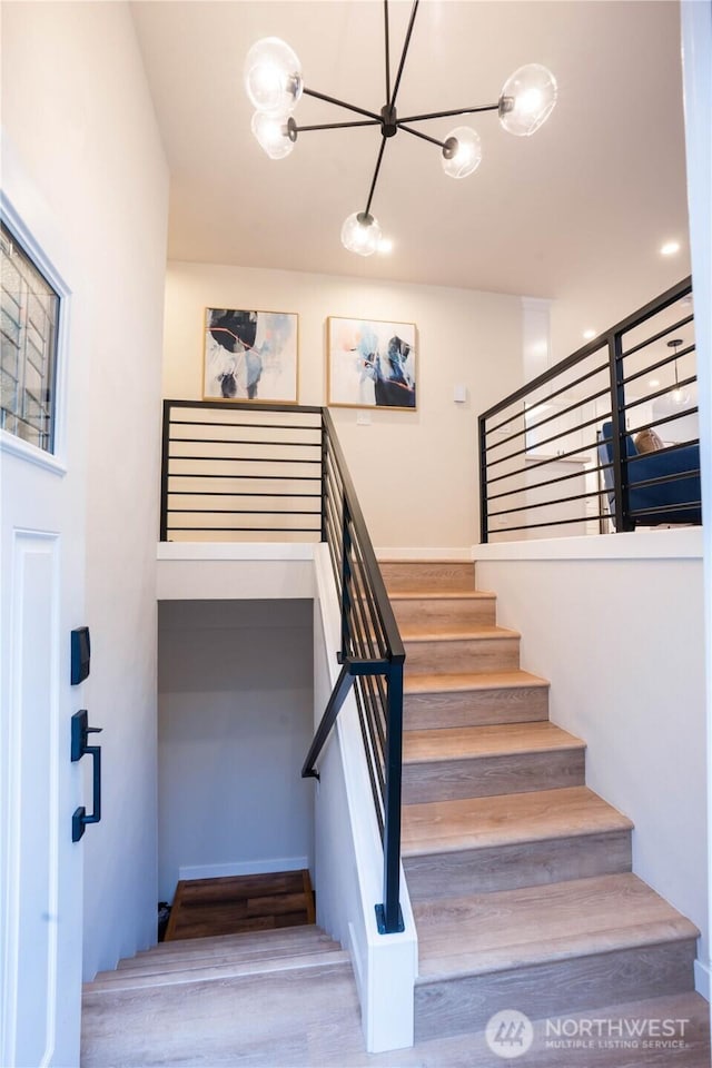 staircase featuring hardwood / wood-style flooring