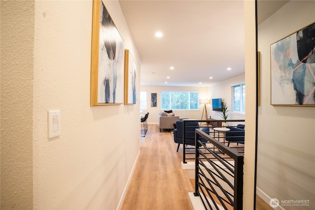 hall with light hardwood / wood-style floors