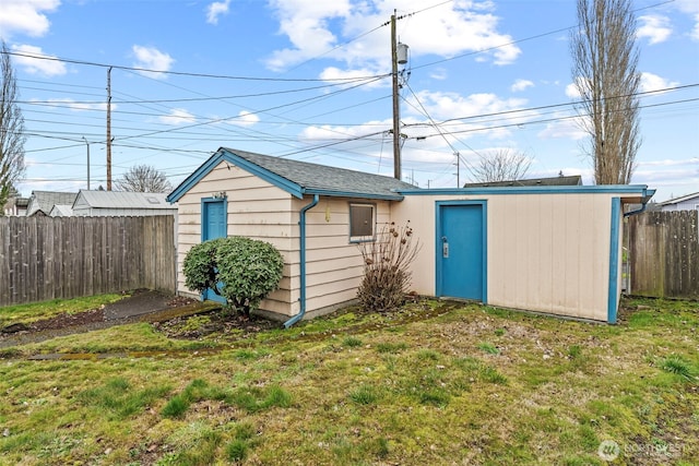 view of outbuilding featuring an outbuilding and fence