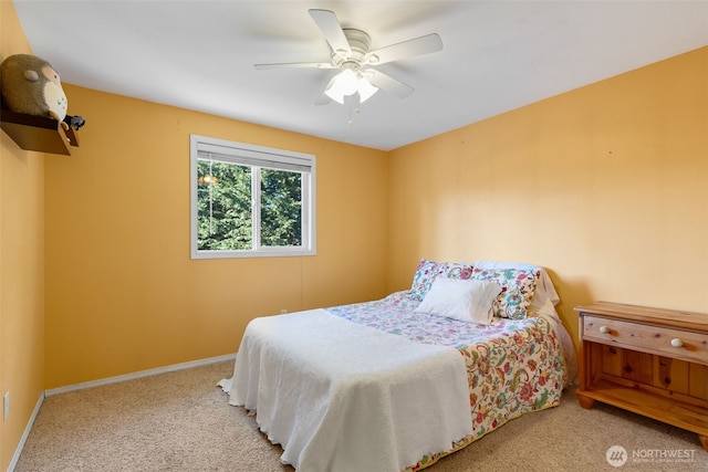 bedroom with ceiling fan and light carpet