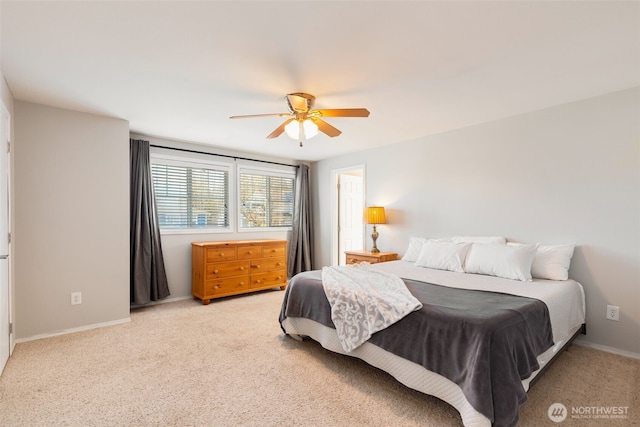 bedroom featuring ceiling fan and light colored carpet