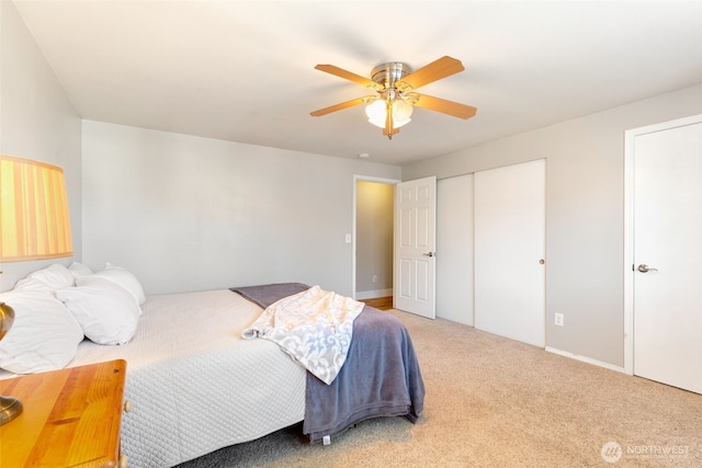 carpeted bedroom featuring ceiling fan