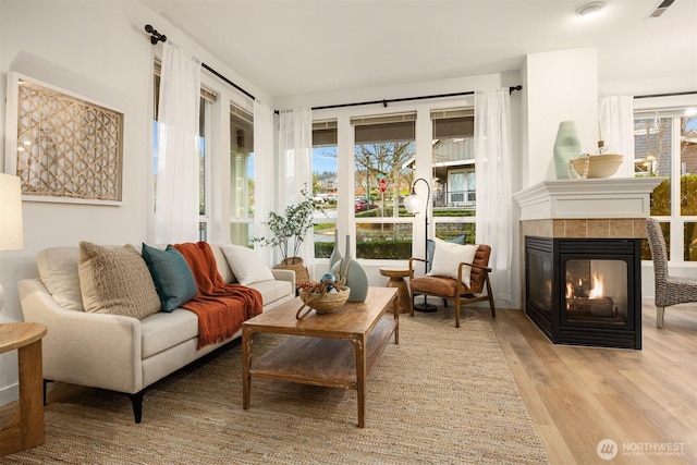 interior space with a tile fireplace