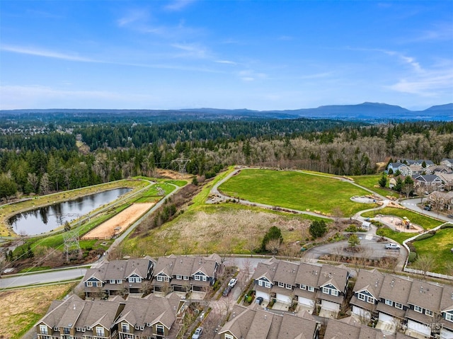 bird's eye view with a residential view, a wooded view, and a water and mountain view